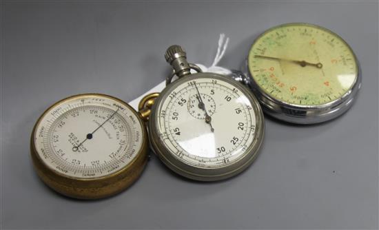 A brass cased pocket barometer and two metal cased military stopwatches